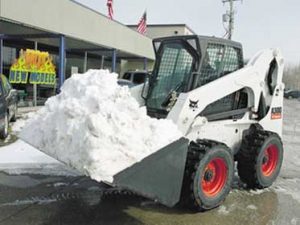 Dawson Creek Snow Removal Service With Bobcat Loading Dump Truck