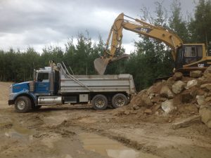 T800 Dump Truck getting loaded with shale Landscaping Dawson Creek BC